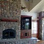 Custom home stone fireplace michael Rust architect  Frank lloyd wright inspired custom home plans by former taliesin fellow