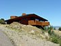 Custom home set on hill by Michal Rust  Frank lloyd wright inspired custom home plans by former taliesin fellow